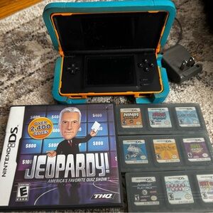 Nintendo DS Console with Blue Nerf Case and Ten Games